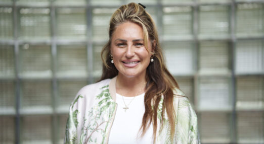 A photograph of Che-Rose, a peer mentor volunteer at Better Lives. She has long hair and is smiling straight at the camera.